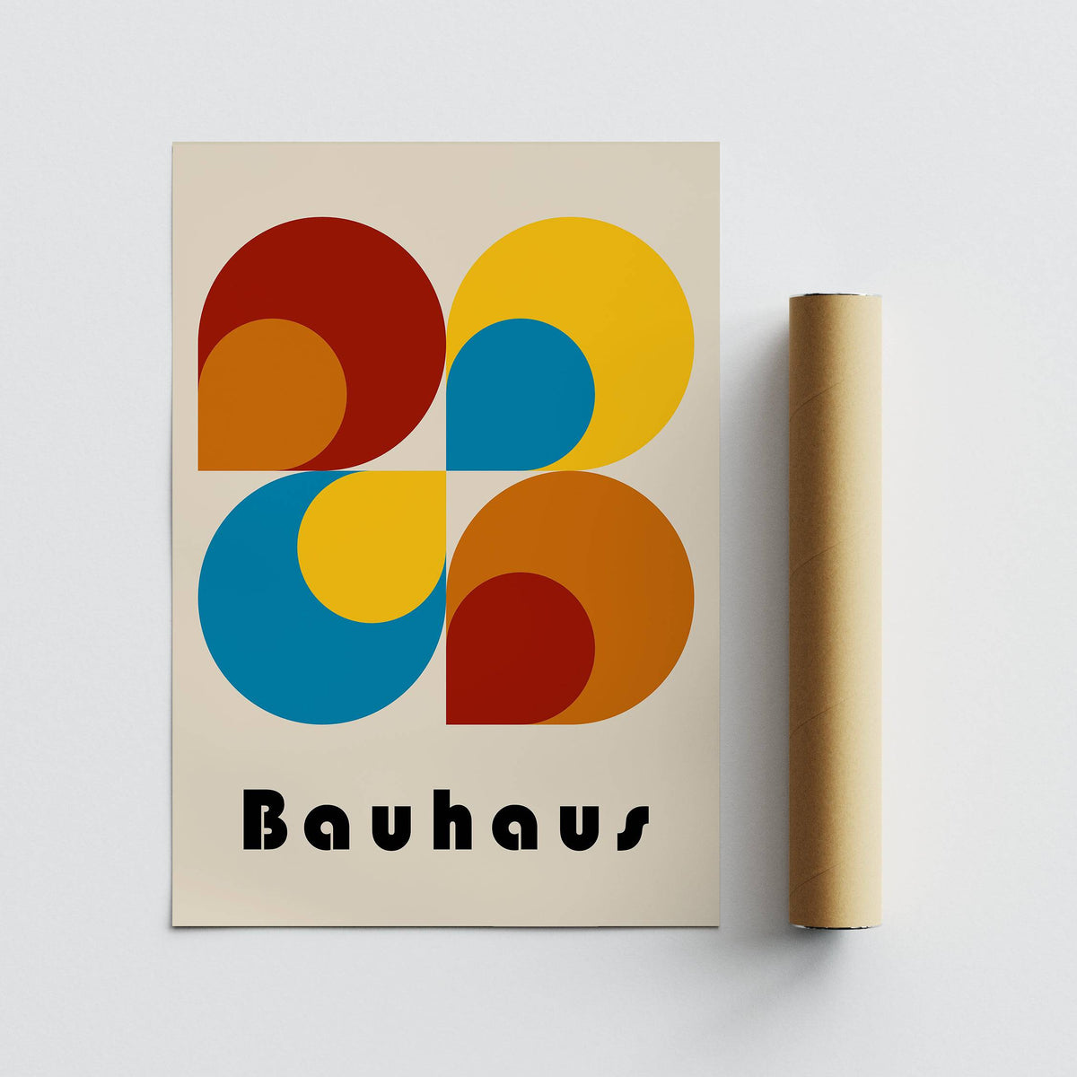 Geometric Prints showing colourful Bauhaus style geometric shapes with a brown packaging tube