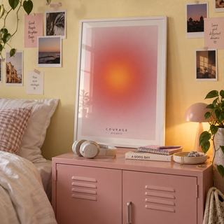 Red and orange aura print above a locker in a teen bedroom