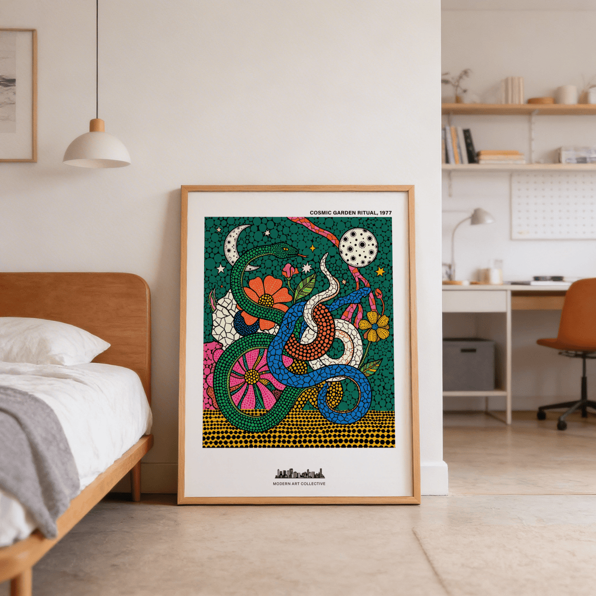 Print leaning on the floor of Cosmic Garden Print showing three intertwined colourful snakes with a floral background in a bedroom