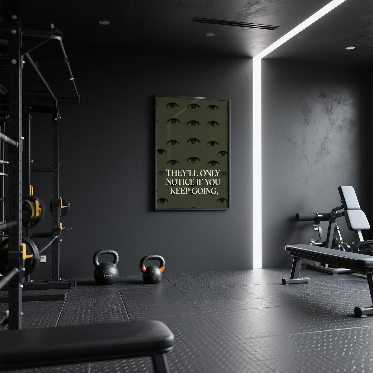 Gym Artwork framed print with eye motif and quote on a dark wall in a gym with kettlebells nearby