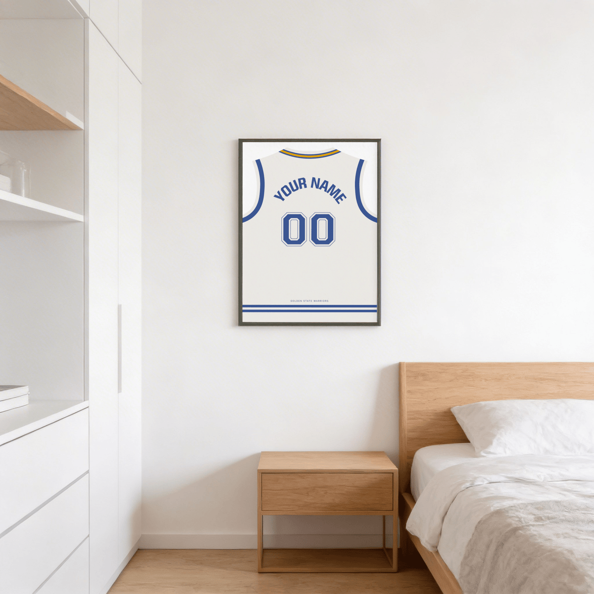 Basketball Jersey Poster in White with Blue Number framed on a bedroom wall above a wooden bedside table