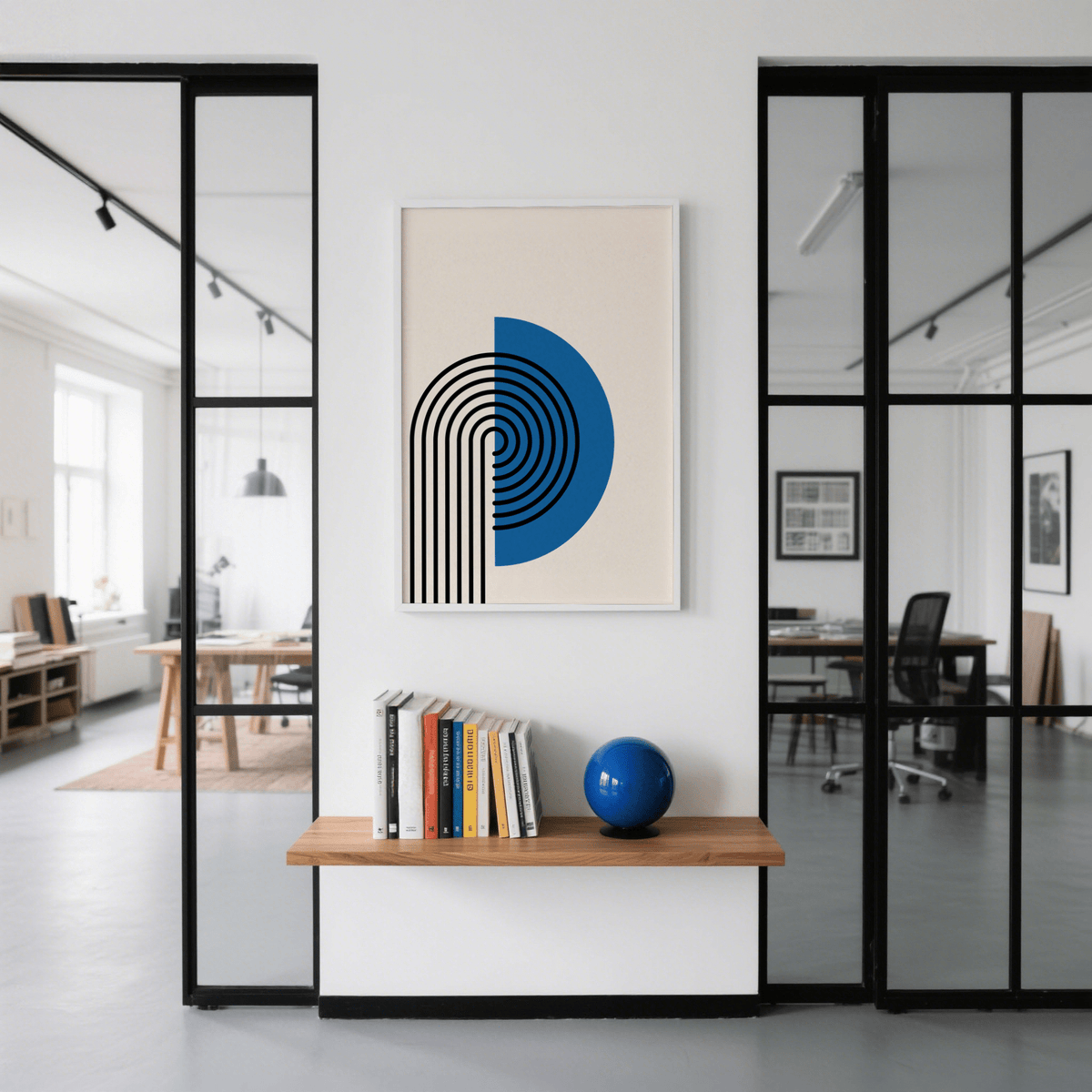 Abstract Arch print hanging in office hall with a wooden shelf and blue globe beneath