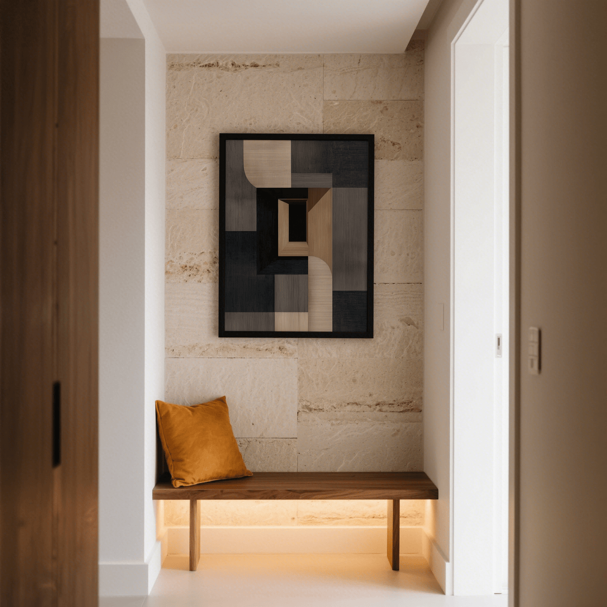 Abstract Wabi Sabi Print with beige and black geometric shapes on a stone wall above a bench with an orange cushion
