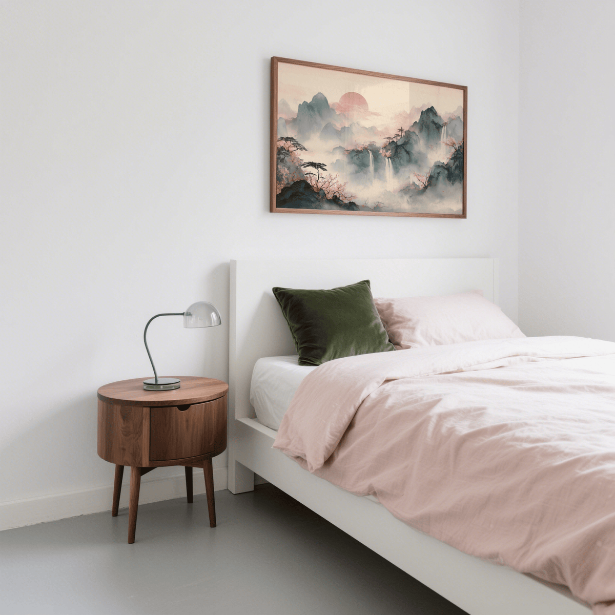 Tiger Mountain wall art of misty mountains with pink sun above a bed with green cushion and wooden bedside table