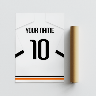 Football shirt poster in white with black sleeve bands lying flat beside a brown packaging tube