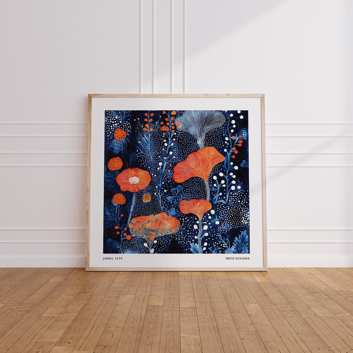 Abstract Flower Art leaning print showing coral dots and blue floral pattern on wooden floor