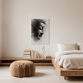 Zen Statue Face Art Print hung above a wooden shelf with books and a sculpture in a neutral-toned bedroom