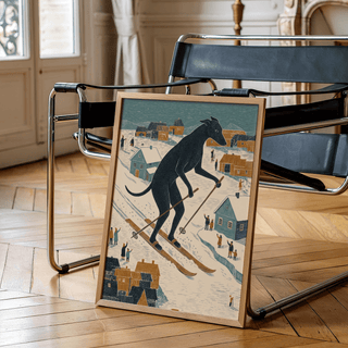 Skiing Dog Art Print leaning on a chair showing a black dog skiing in folk-art style with muted colours in a wooden frame