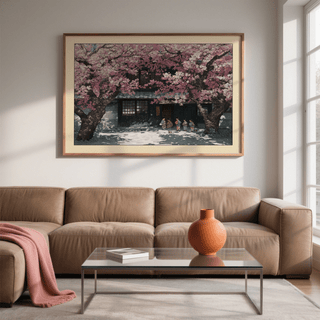 Hasui Kawase Cherry Blossoms wall art of children under pink trees above a brown sofa with a terracotta vase