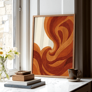 Abstract Wave Art Print leaning on a windowsill with orange and brown wave lines and books nearby
