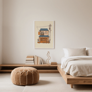 Japanese style art print of a cosy bakery house in orange and blue above a wooden low shelf in a bedroom
