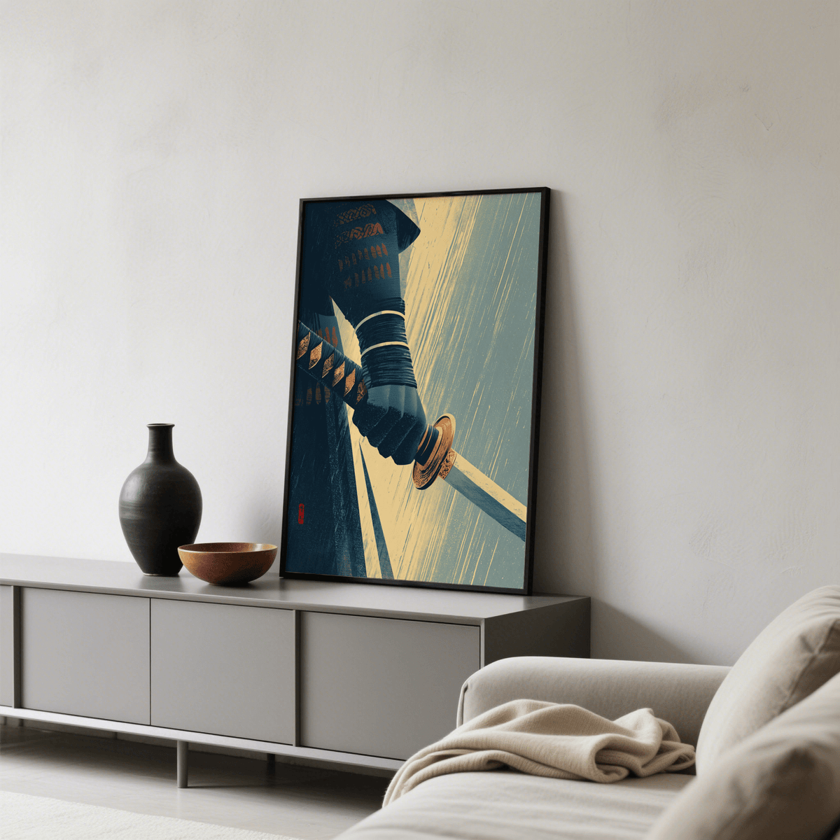 Katana wall art leaning on a sideboard with a black vase and bowl in a living room