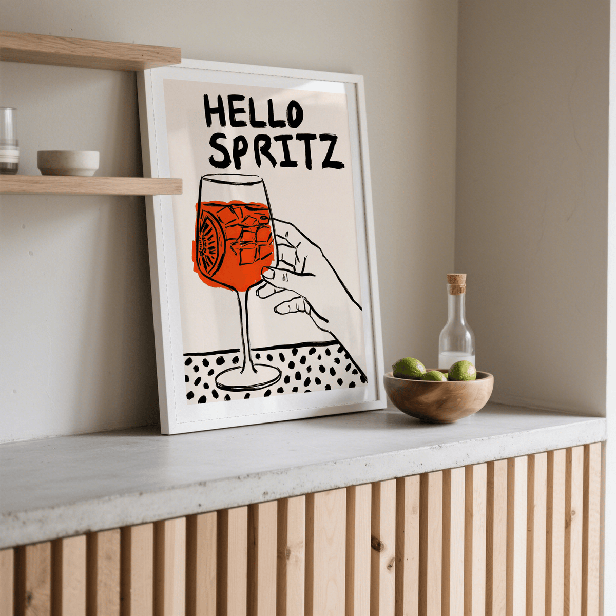 Spritz Print leaning on a shelf with a bowl of limes and a glass bottle nearby