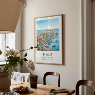 Maldives City Art Print watercolour of coastal town and boats above a dining table with flowers