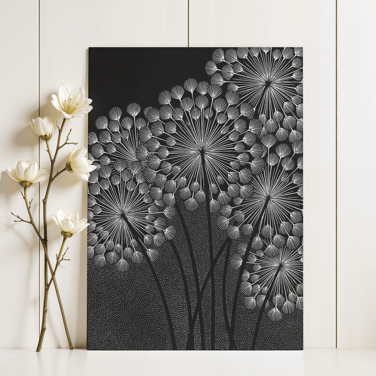 Dandelions wall art leaning on a white surface with white flowers beside it