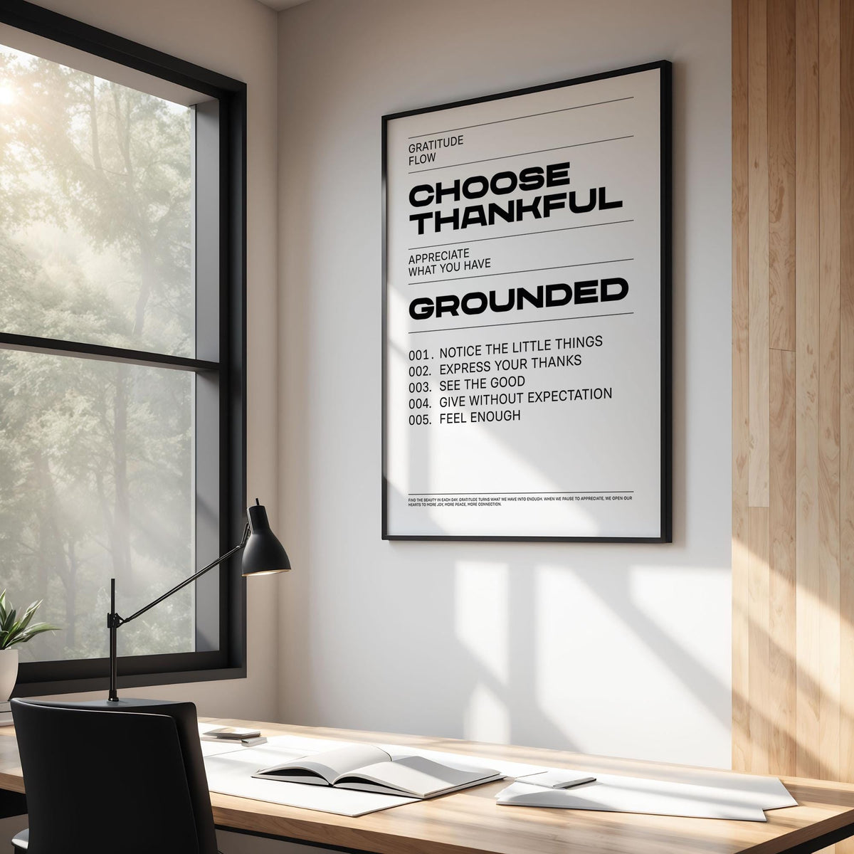 Gratitude wall art with thankful gratitude text in black and white in a modern office with desk lamp
