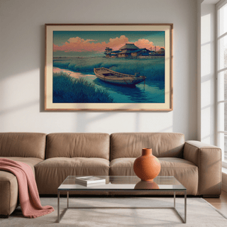 Hasui Kawase River Boat print on a wall with wooden frame above tan sofa and glass coffee table with orange vase