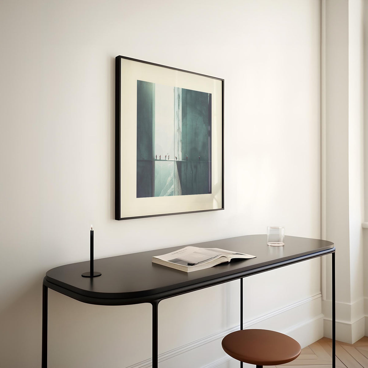 Surreal art prints of rope climbers in muted blue and grey above a black console table