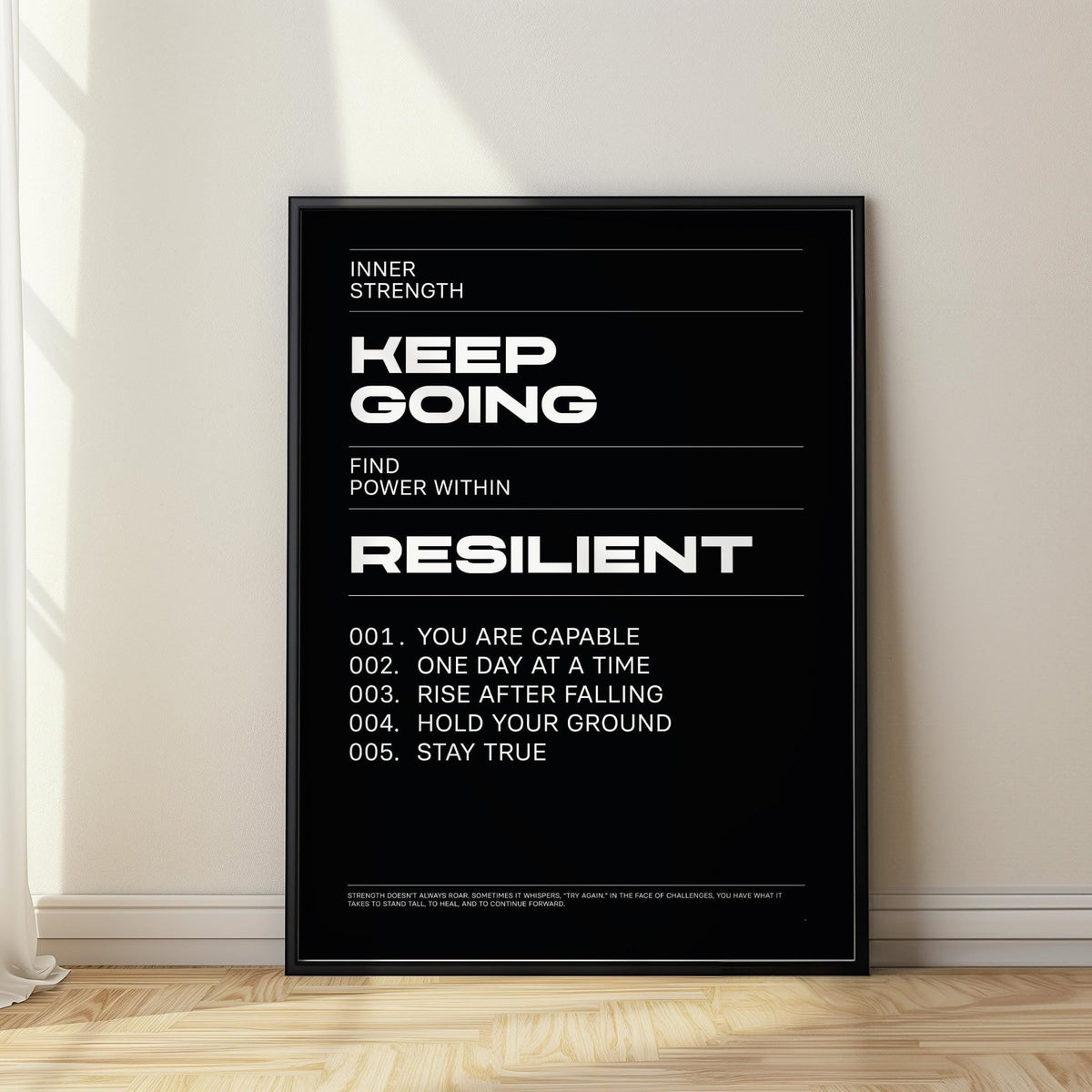 Work Hard wall art leaning against a wall with black background and white motivational text with light wood floor