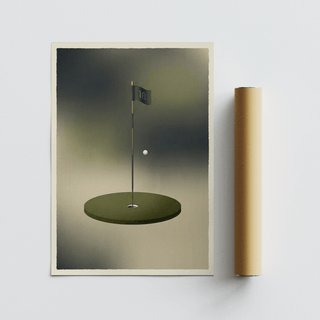 Minimalist golf wall art with a green putting surface and white golf ball next to packaging tube