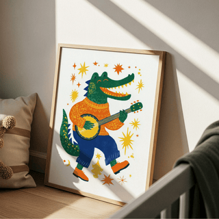 Print leaning on floor of funny crocodile art print with orange stars and green banjo