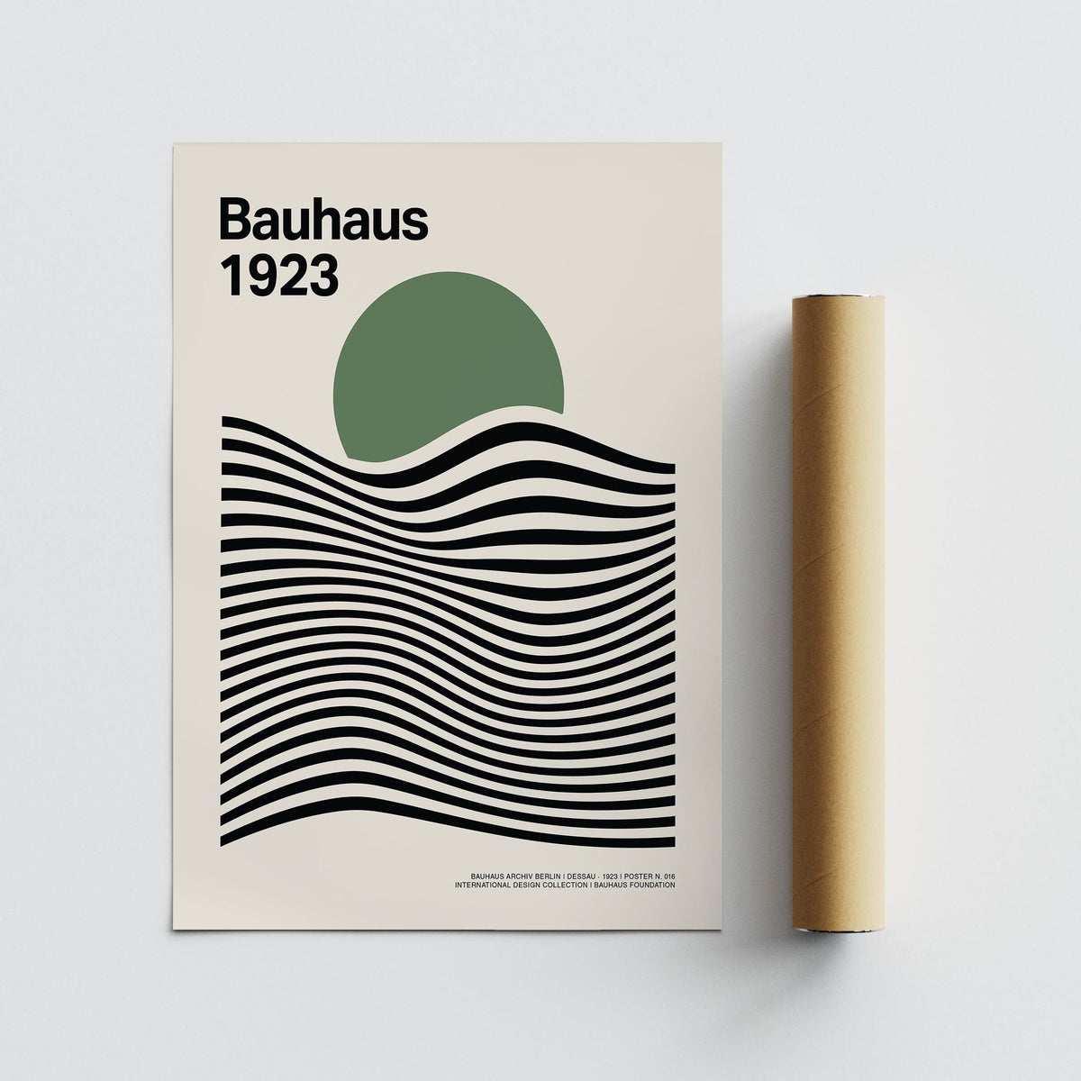 Sage Green Print showing green circle and black wavy lines beside packaging tube on grey background