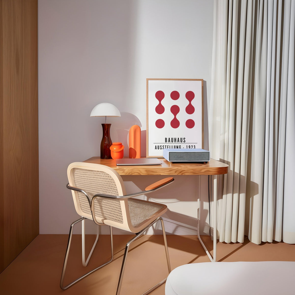 Artwork for Office Walls print with abstract red shapes leaning on a desk by a lamp