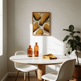 Spaghetti wall art of dry spaghetti bundles in a contemporary style above a round dining table with amber bottles