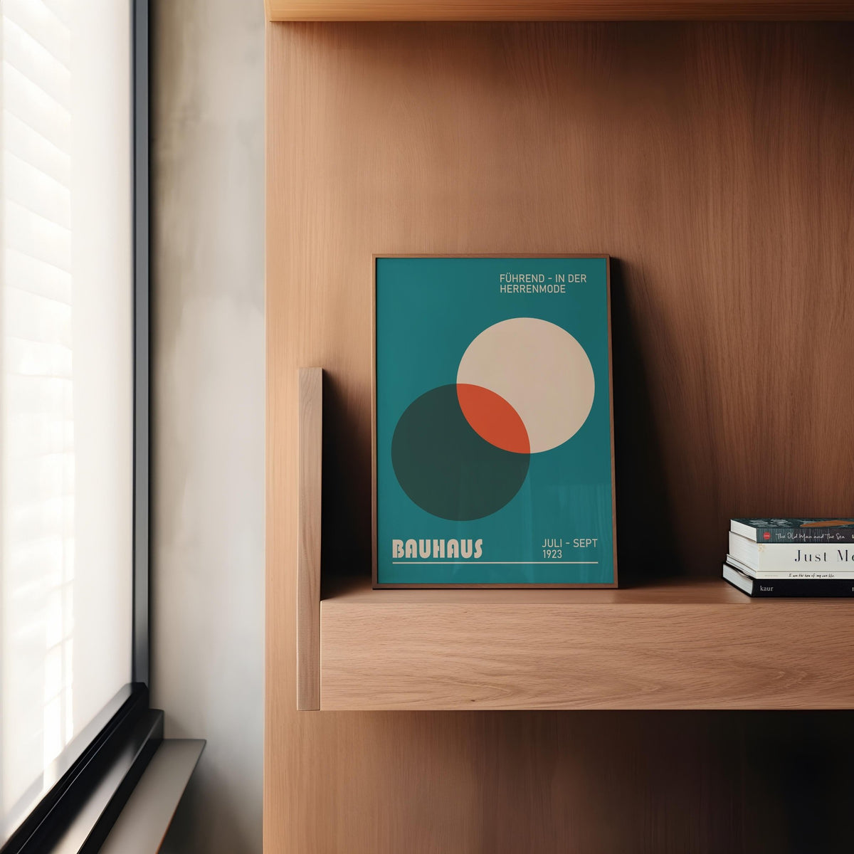 Modern Office Wall Art of overlapping circles in teal, cream and orange leaning on a wooden shelf next to books