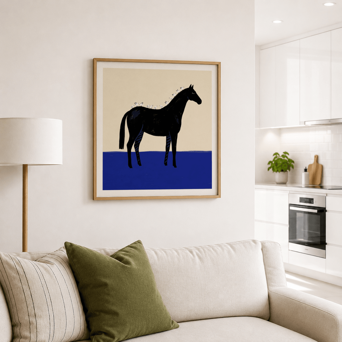 Black Horse wall art showing a black horse with white birds on a blue patch above a cream sofa with green and striped cushions