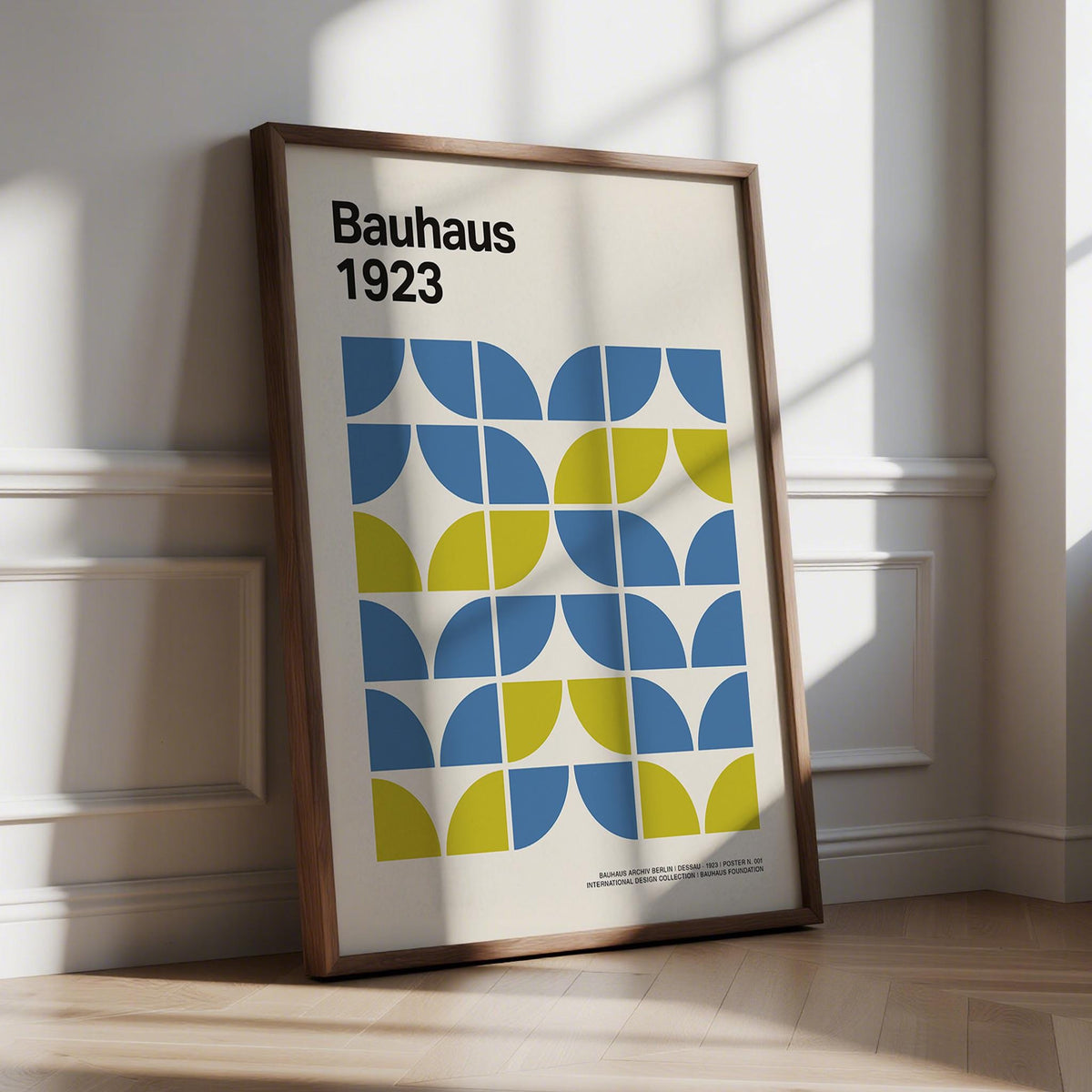 Modern Office Wall Decor framed print leaning against a white wall with sunlight casting shadows