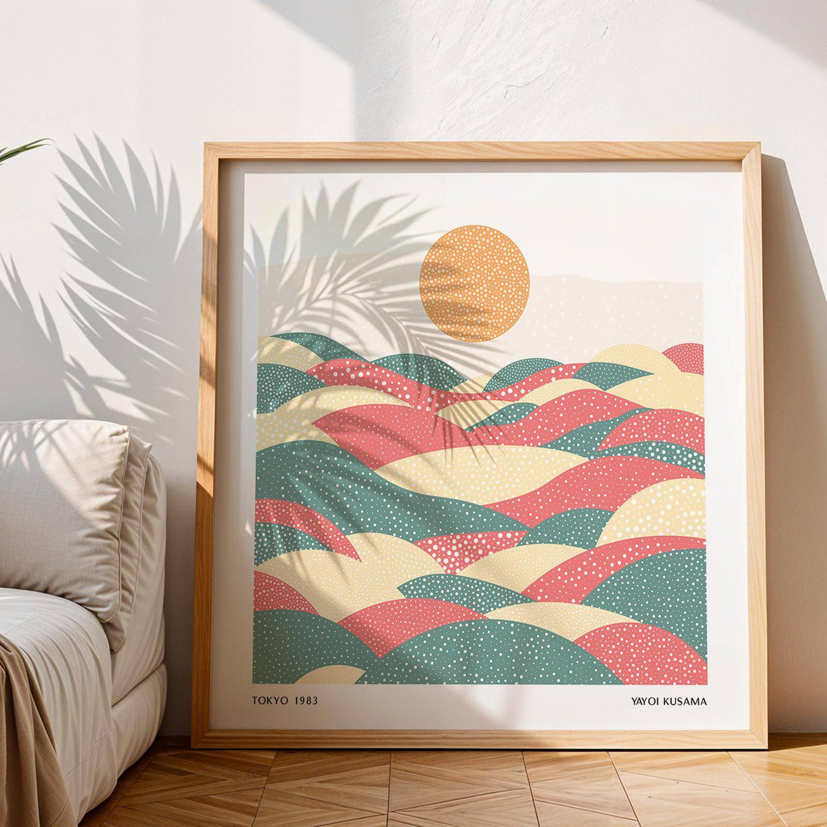 Framed pastel abstract artwork of dotted hills and sun with shadow of palm leaves