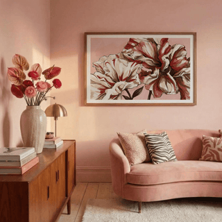 Elegant Floral Art framed print of abstract watercolour flowers in blush and cream on the wall in a pink living room with a wooden sideboard