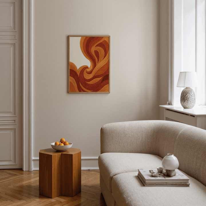 Abstract Wave Art Print with warm orange and brown wave lines above a wooden side table in a living room
