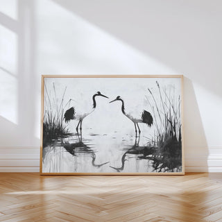 Minimalist Bird Art leaning print with pair of black and white cranes on wooden floor