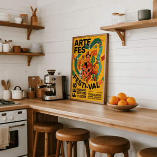 Frida Kahlo art print with vibrant folk-art colours leaning on a wooden kitchen counter with a bowl of oranges