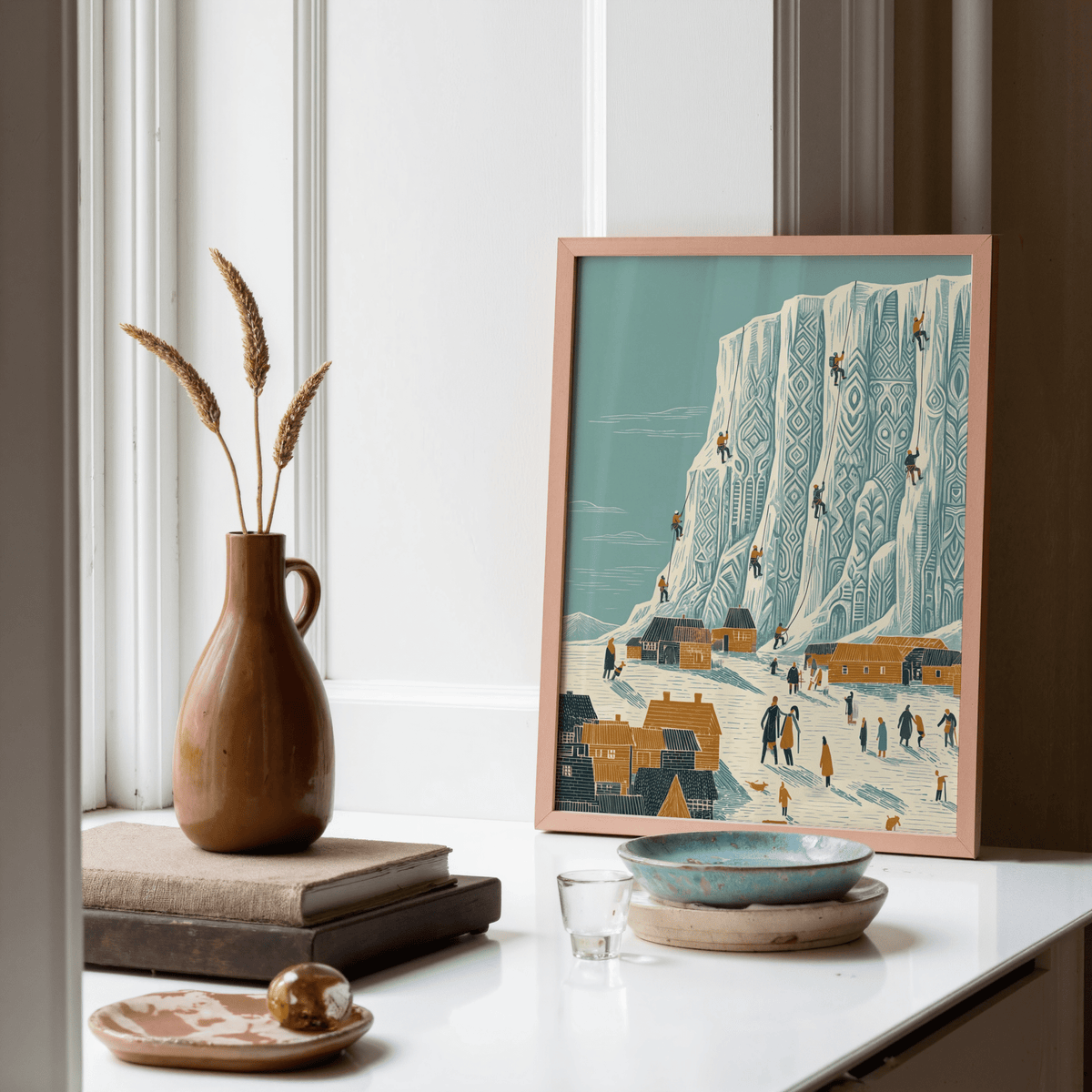 Mountain Climbing Art Print leaning on a shelf with a brown vase and books in soft colours