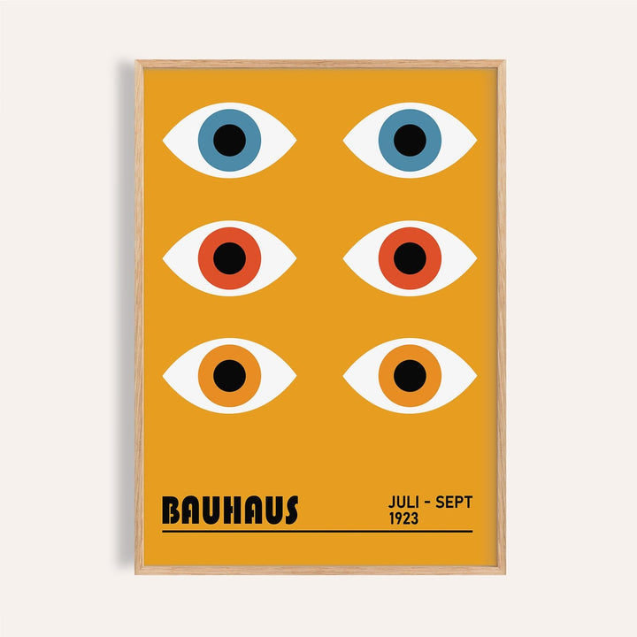 Eye Poster of stylized blue orange and red eyes in a minimalist bauhaus style in a light wooden frame