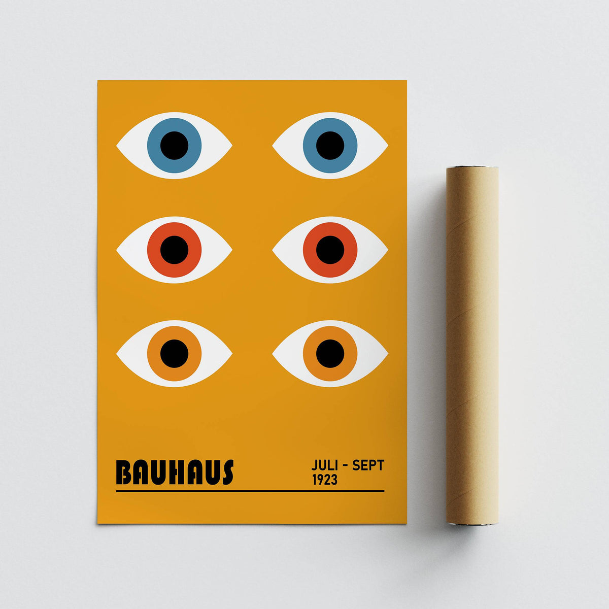 Eye poster with stylised eyes in blue and orange next to a brown packaging tube