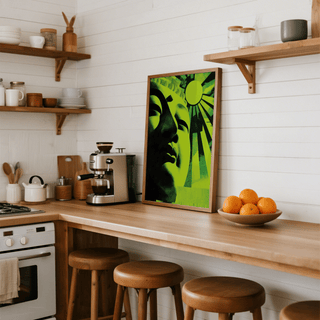 Zen Face wall art leaning on a kitchen counter with a bowl of oranges and coffee machine nearby