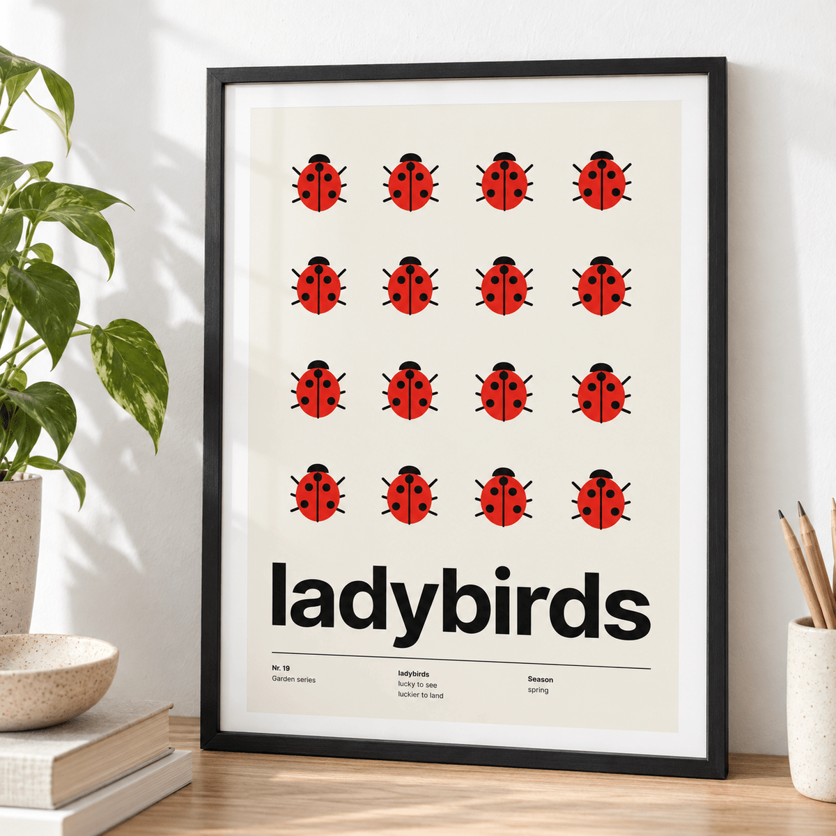 Close view of the sixteen red ladybirds in a grid showing the fine print detail