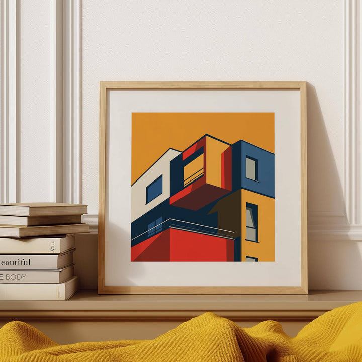 Posters for Office Space framed print of a modern building facade in bold minimalist colours with stacked books nearby