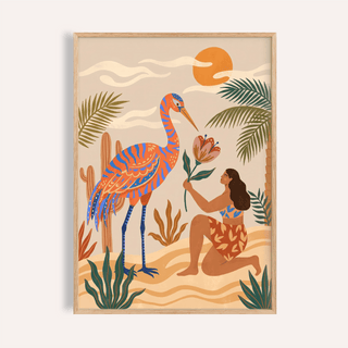 Framed Tropical Bird Artwork showing a woman with a large blue and orange bird and tropical plants