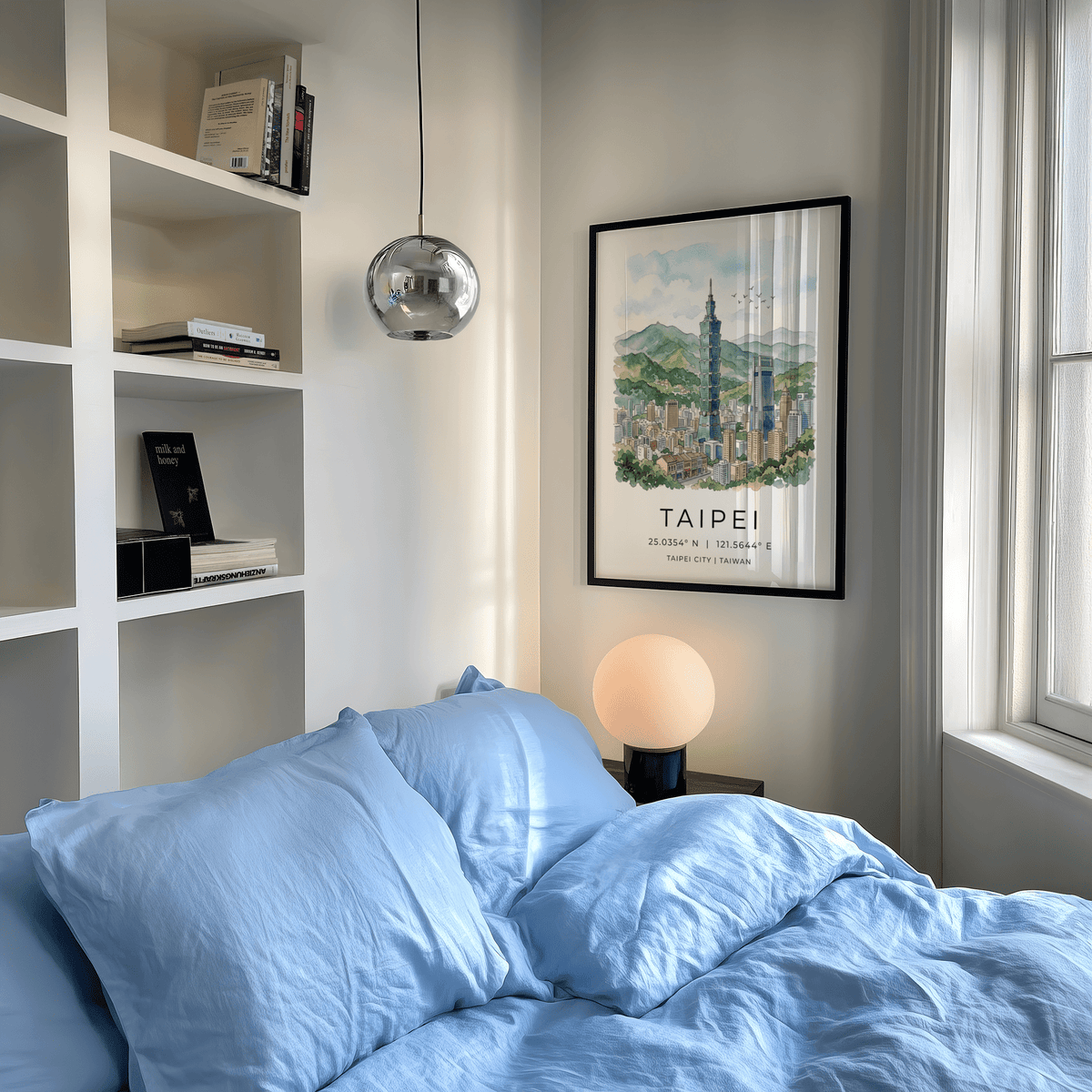 Framed Taipei City art print of Taipei 101 skyscraper in watercolour above a bedside table lamp