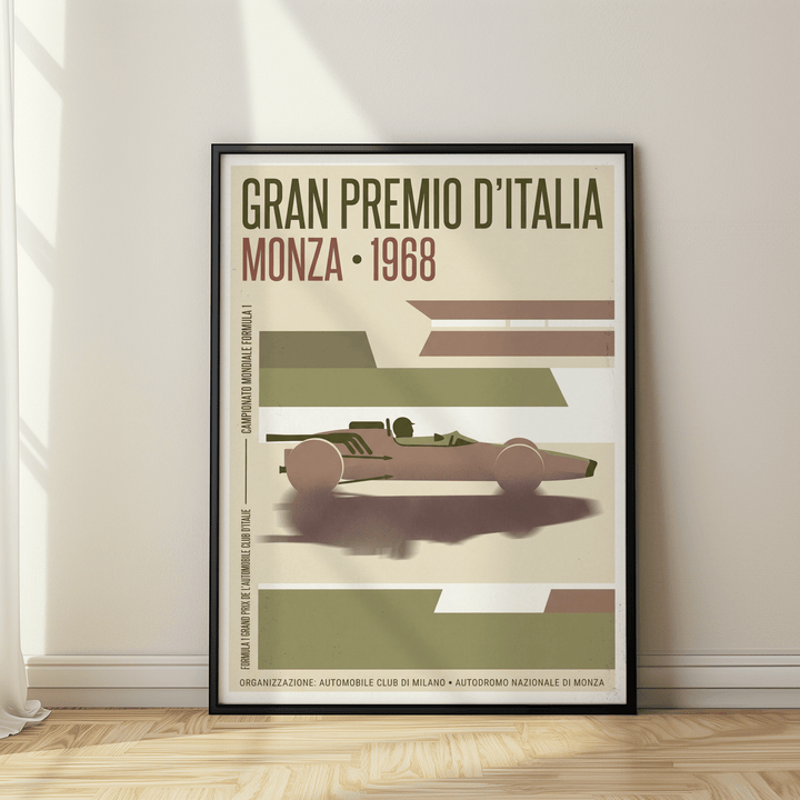 Framed Monza Grand Prix Poster with 1968 race car and vintage green and brown tones leaning on a wooden floor