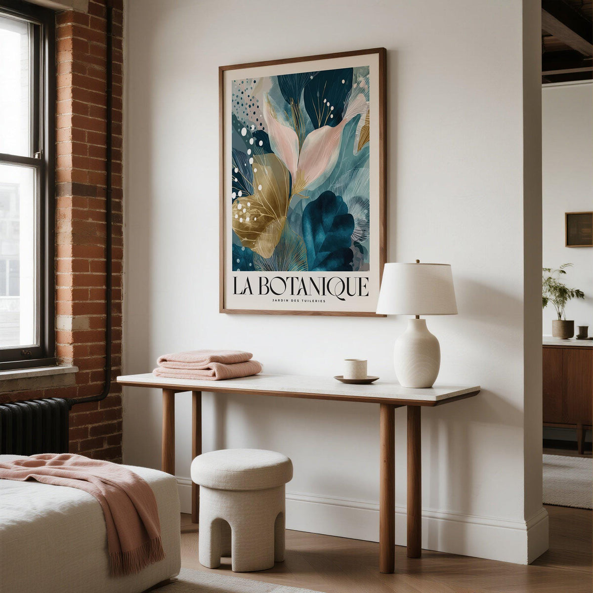 Elegant wall art for living room with abstract floral design in blue, beige and pink above a table with lamp