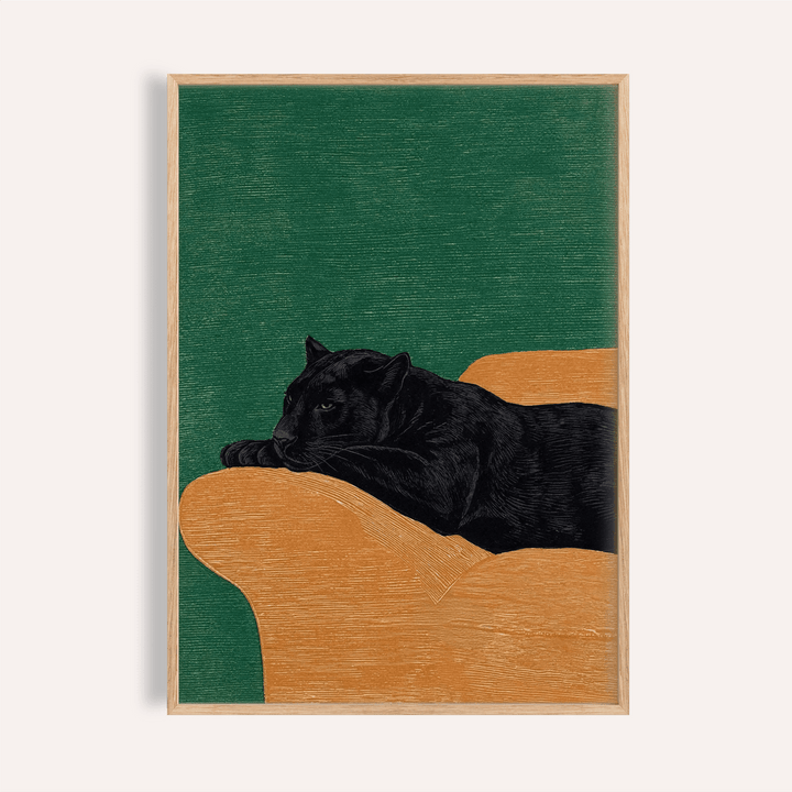 Framed print of Big Cat Art Print showing a black panther lying on an orange surface with a green background