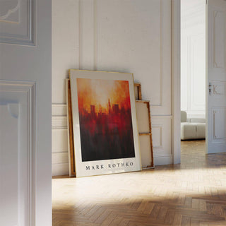 California wall art leaning on a wooden floor with warm orange and black abstract city skyline