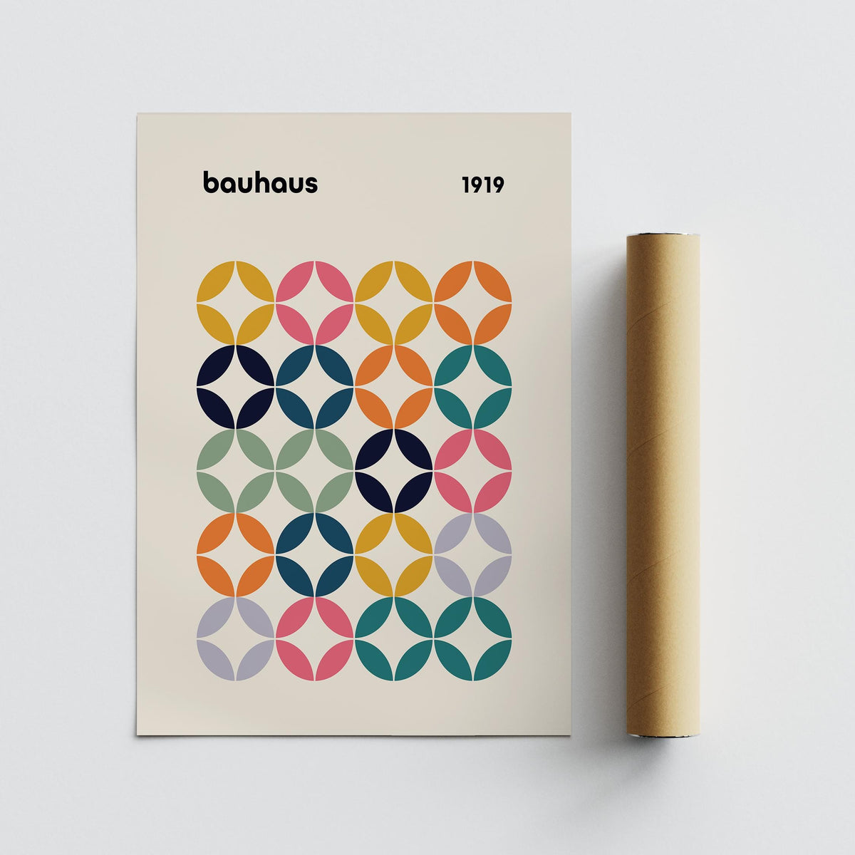 Colorful wall art office showing a bauhaus style colour grid print with a packaging tube