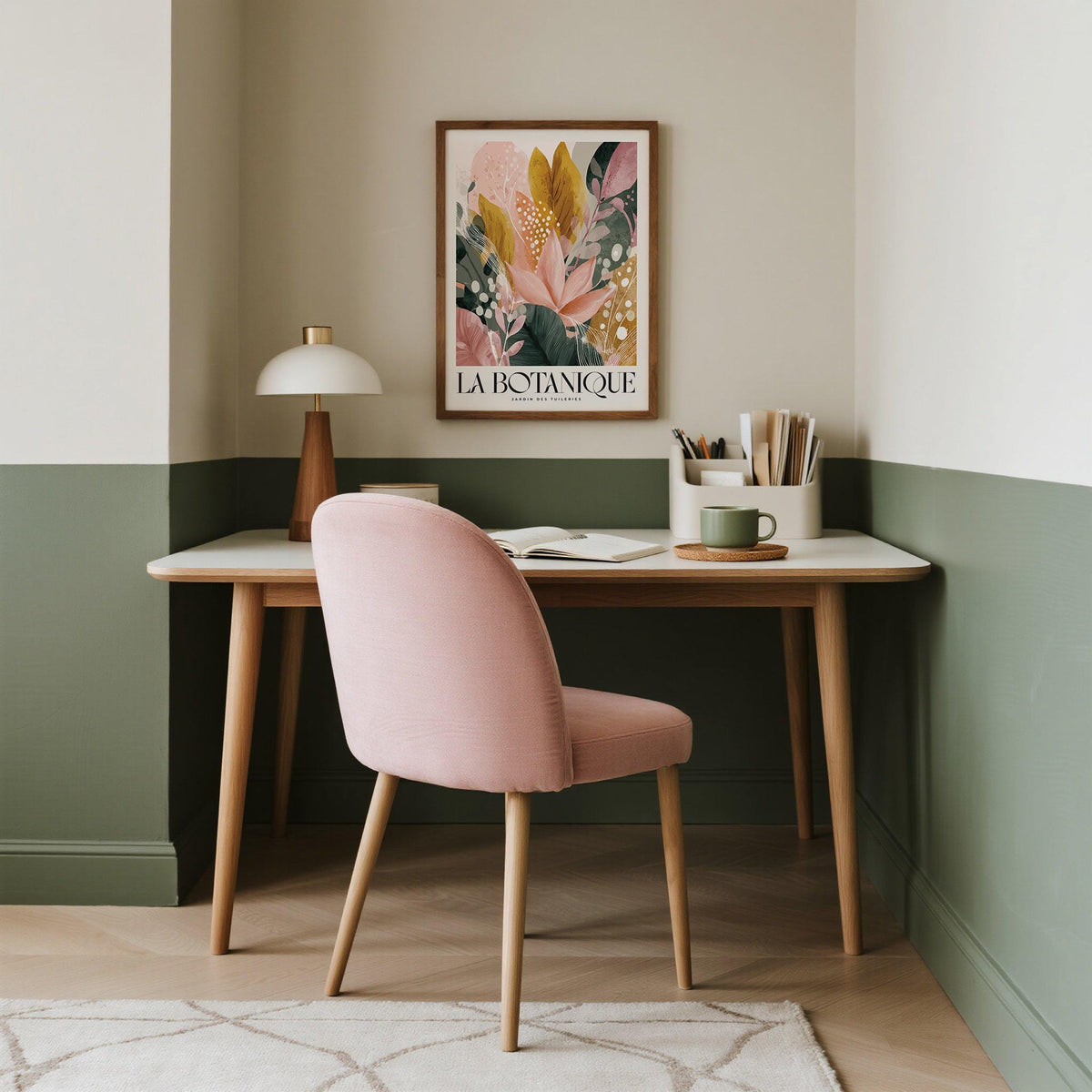 Flower Prints wall art of abstract botanical leaves in pink green and gold above a desk with a lamp